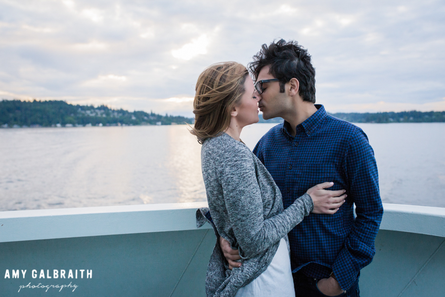 couple kissing at twilight on a ferry to seattle