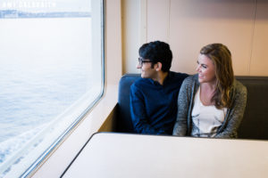 couple looking out the window on a ferry ride to seattle