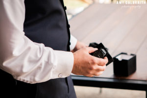 groom receiving watch as gift on wedding day