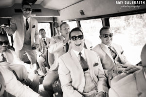 groomsmen all riding on a shuttle to a wedding