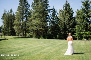 bride walking across the lawn at swiftwater cellars