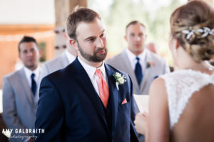 groom listening to bride's vows