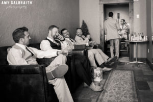 groomsmen laughing candid with his groomsmen