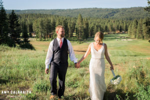 bride and groom walking on the scenic property of swiftwater cellars