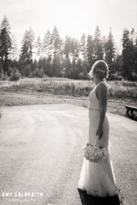 black and white image of bride wearing monique lhuillier at sunset