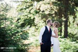 bride and groom kissing at swiftwater cellars