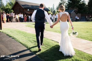 bride and groom enter the cocktail hour at swiftwater cellars