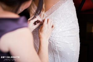 bride zipping boho gown