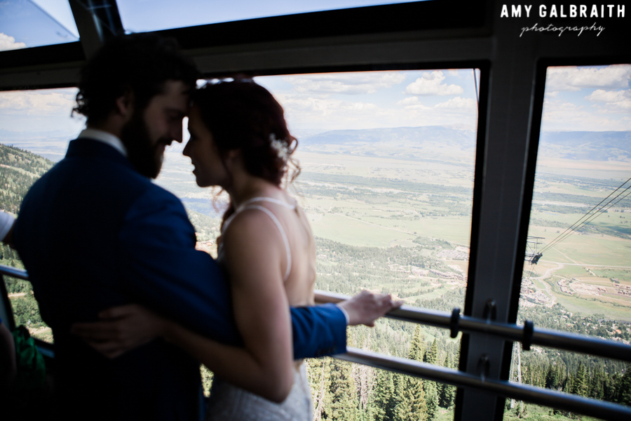 bride and groom riding jackson hole mountain resort tram