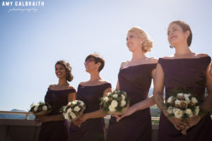 bridesmaids wearing purple satin gowns