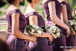 purple bridesmaids dresses and pinecone bouquets