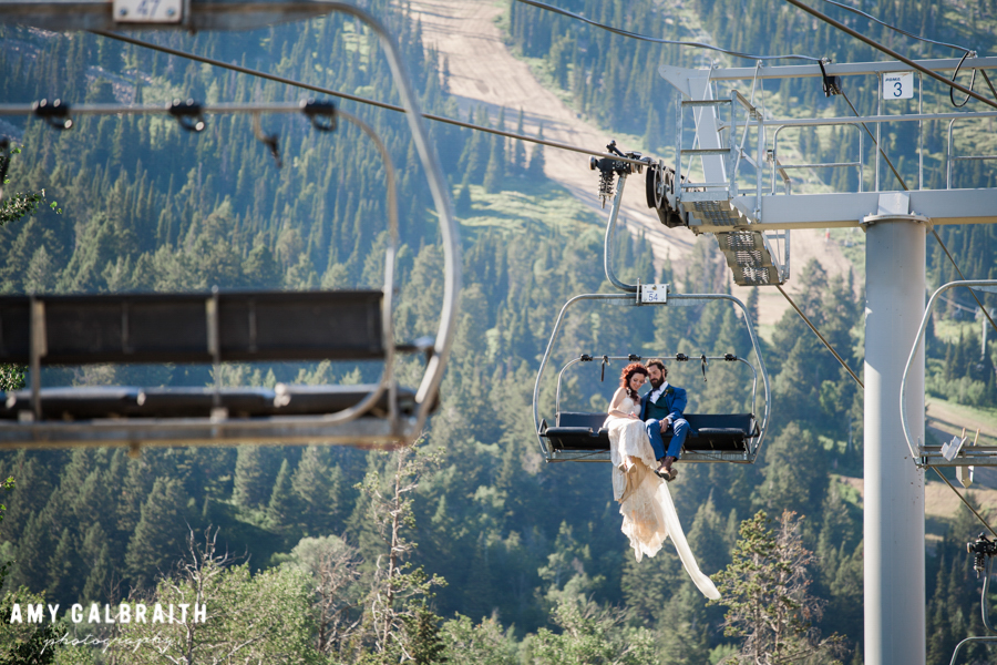 bride and groom riding chairlift at jackson hole mountain resort