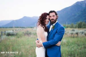 bride and groom with jackson hole mountains in the background