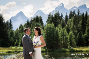 bride and groom in front of the tetons