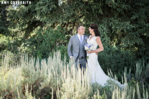 bride and groom in the sage brush at schwabacher's landing