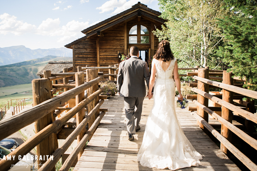 bride and groom walking into the granary in jackson hole