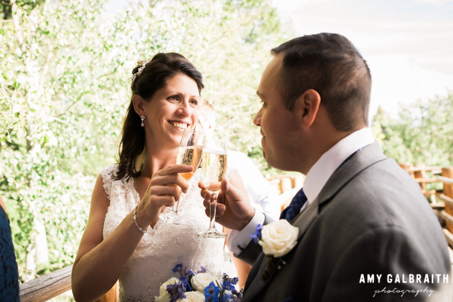 bride and groom toasting champagne after wedding ceremony
