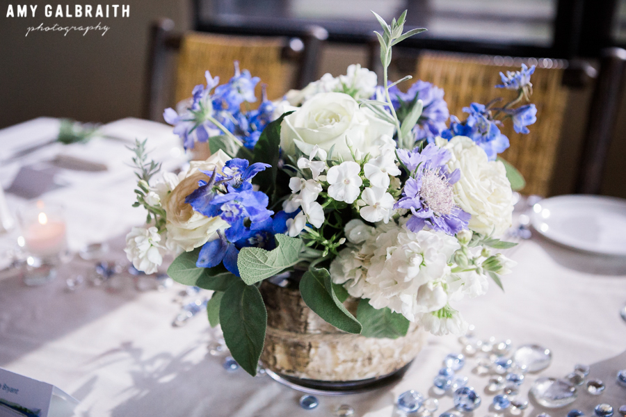 blue and purple floral centerpieces at wedding reception