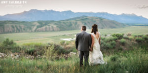 A bride and groom enjoy sunset after their Grand Teton wedding in Jackson Hole
