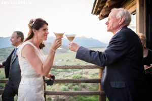 bride toasting friend with espresso martini