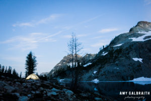 night photo of a tent at wing lake