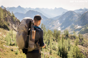 guy wearing giver shirt hiking in the north cascades