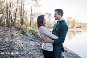couple hugging near snoqualmie river