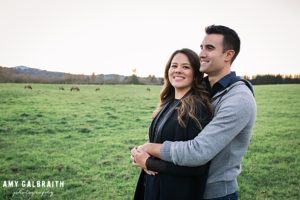 couple in front of herd of elk at snoqualmie engagement session