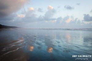 dusk and cloud reflections on kalaloch beach in olympic national park