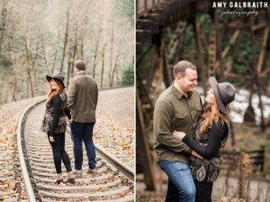 A couple standing next to the railroad tracks at Stevens Pass