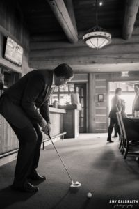 groomsmen practicing putting at wedding