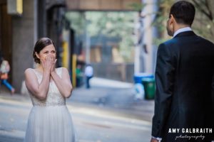 bride sees her groom during the first look on their wedding day