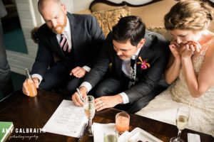 bride and groom sign marriage license on MV Skansonia