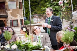 father of the bride gives a toast at talus rock retreat wedding in idaho