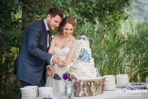 bride and groom cut their aspen cake at mountain springs lodge wedding in leavenworth
