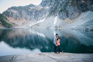 couple posting at lake serene during their engagement session