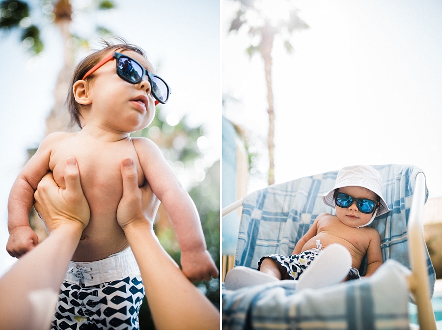 baby wearing board shorts and sunglasses