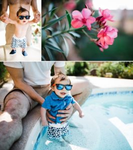 baby taking a dip in the pool for the first time