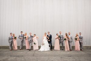 pink and grey wedding party in urban setting