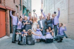 wedding party wearing lavender in alley in seattle