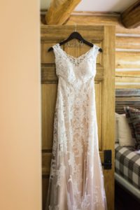 lace wedding gown in rustic cabin