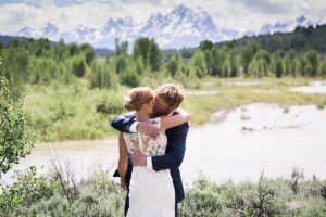 bride and groom kiss at heart six ranch in jackson hole