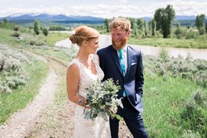 bride and groom on the trail at heart six ranch