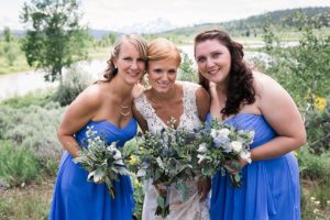 blue bridesmaids dresses and wildflower wedding bouquets