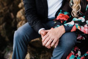 bride shows off beautiful rose gold engagement ring