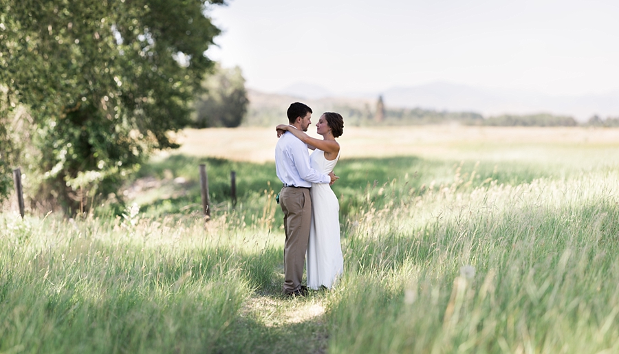 bride and groom in the fields in the methow valley