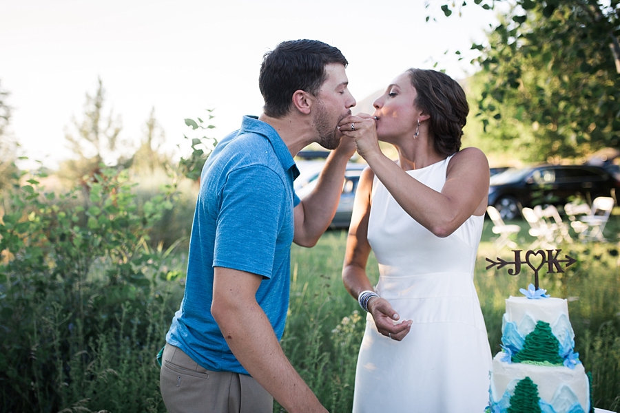 bride and groom feed each other cake in the methow valley