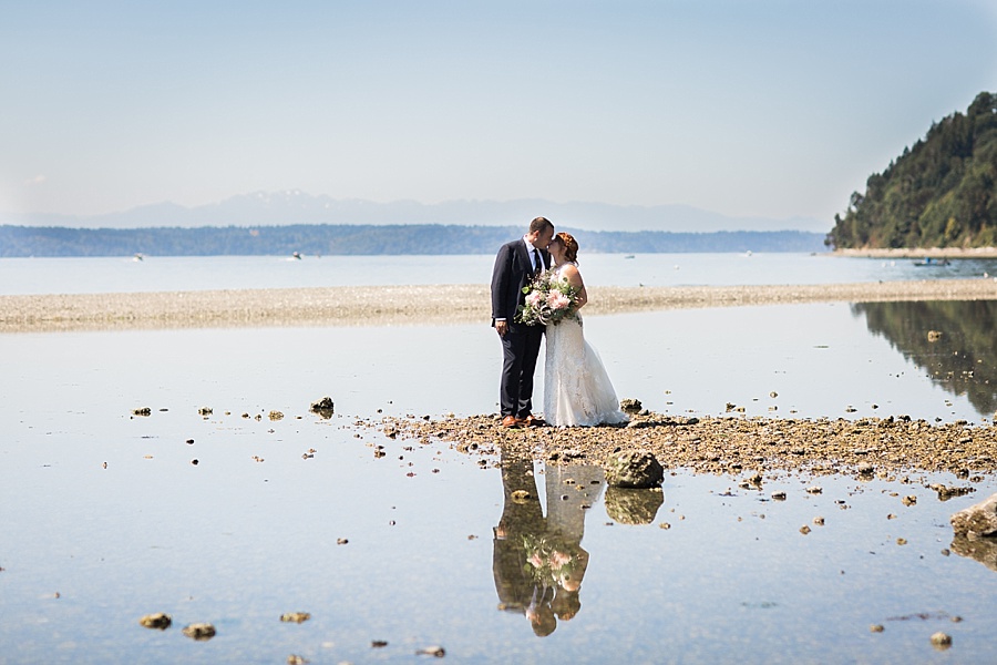 couple kissing on the beach in des moines wedding