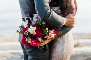 Maroon and White wedding bouquet with sequin wedding gown