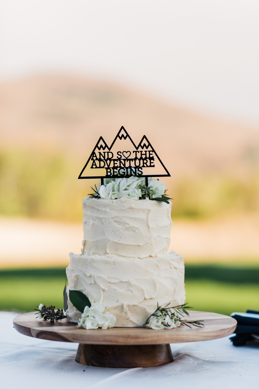 Mountain Themed Wedding Cake at Sun Mountain Lodge Wedding photographed by mountain wedding photographer Amy Galbraith